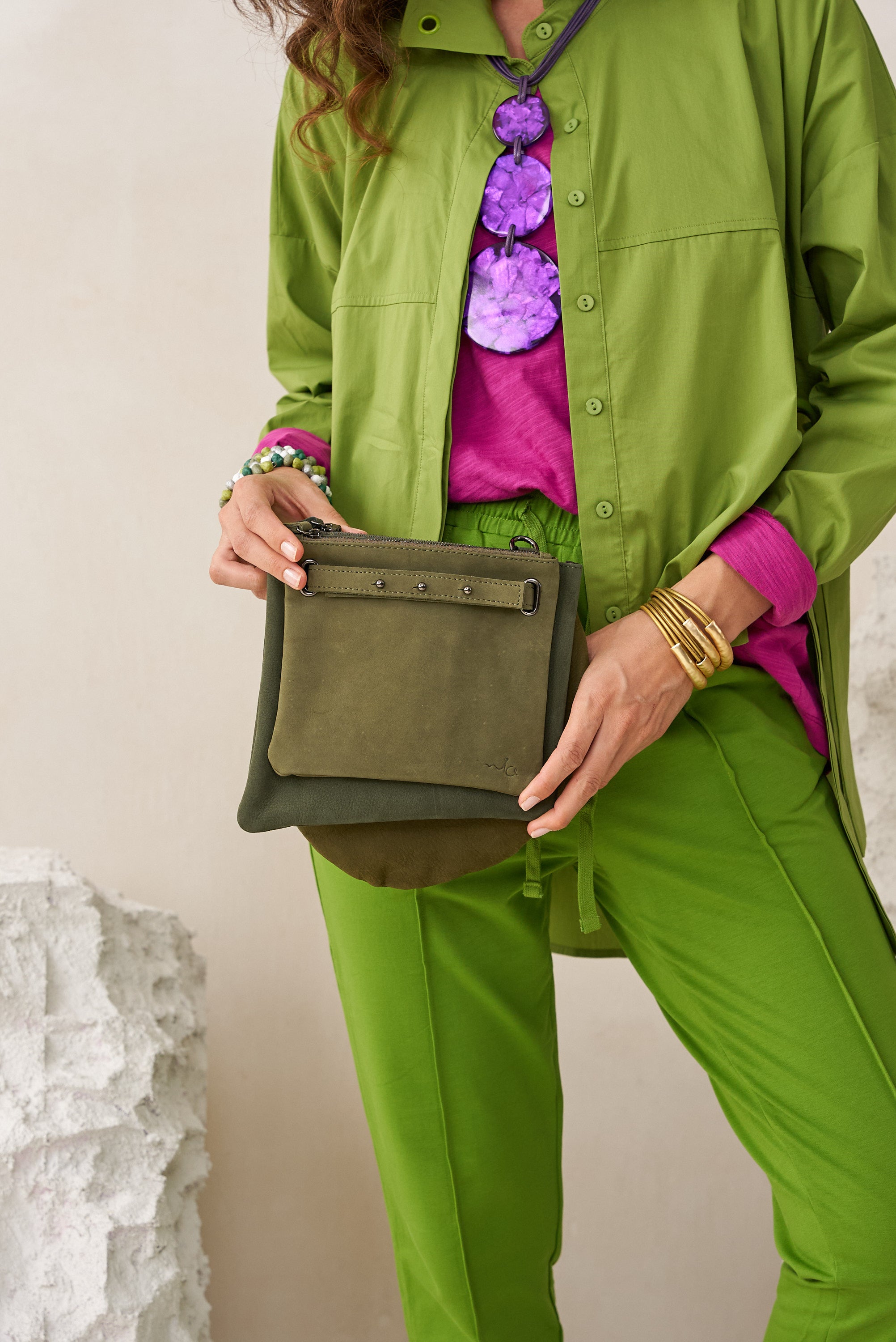 Green three-pocket leather evening bag