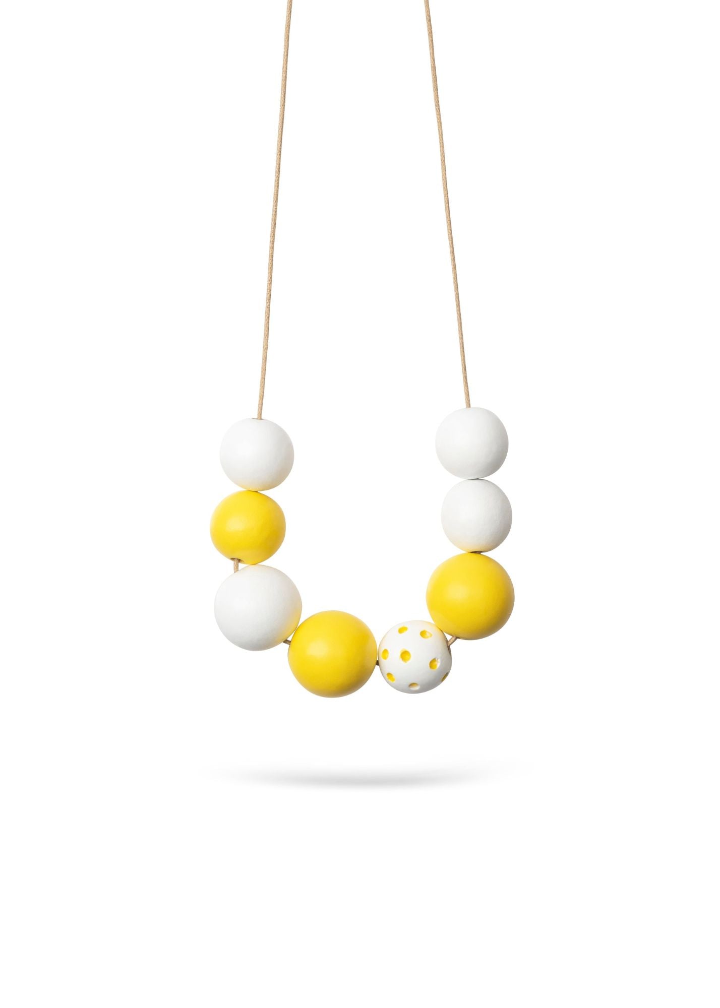 A necklace of large yellow dotted beads