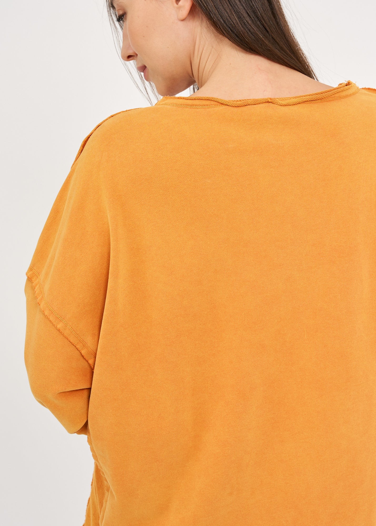 Wash sweatshirt with reverse fabric hem, orange wash