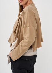 A thin top with a brown wrapped scarf