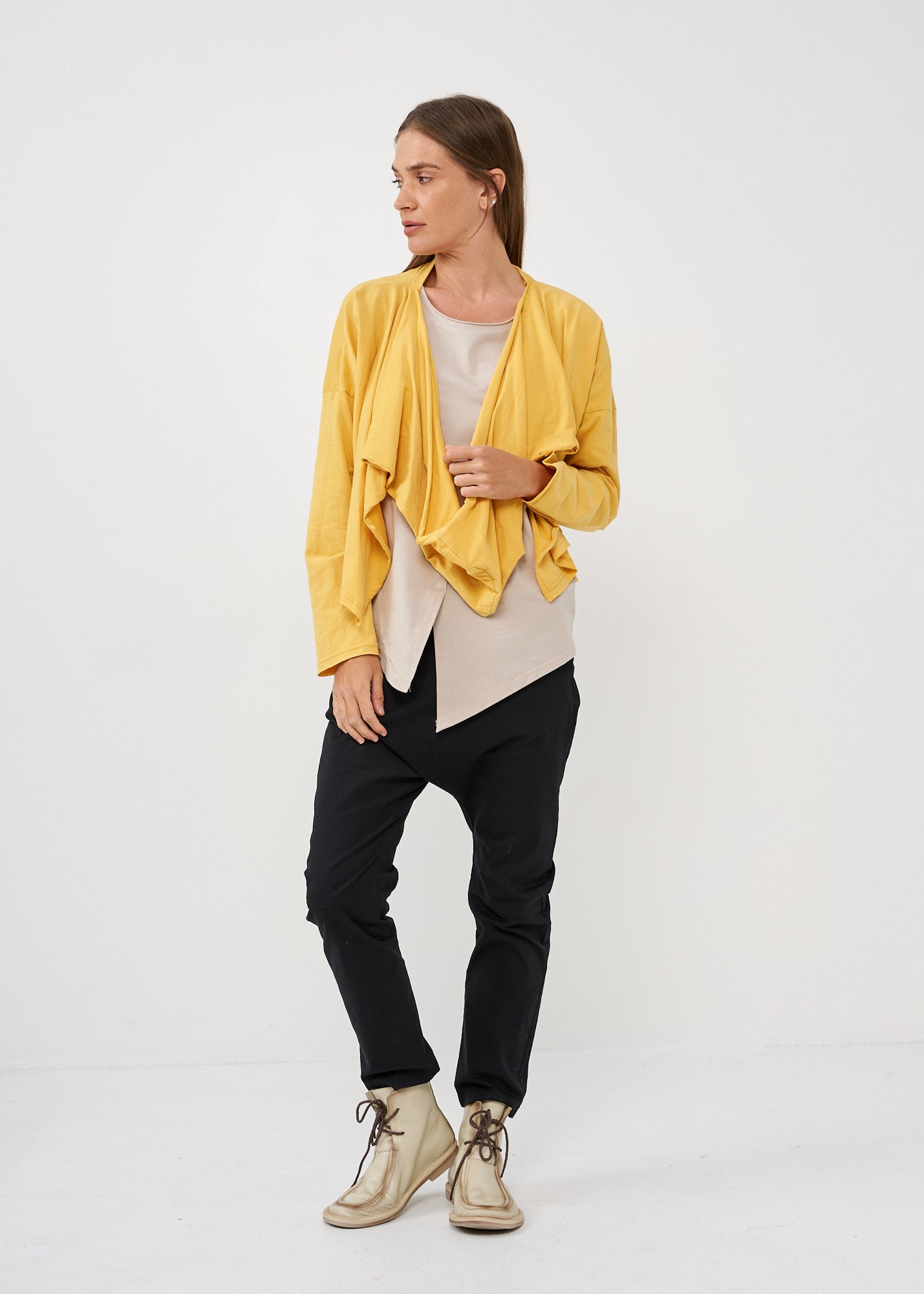 A thin top with a mustard wrapped scarf