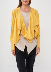 A thin top with a mustard wrapped scarf