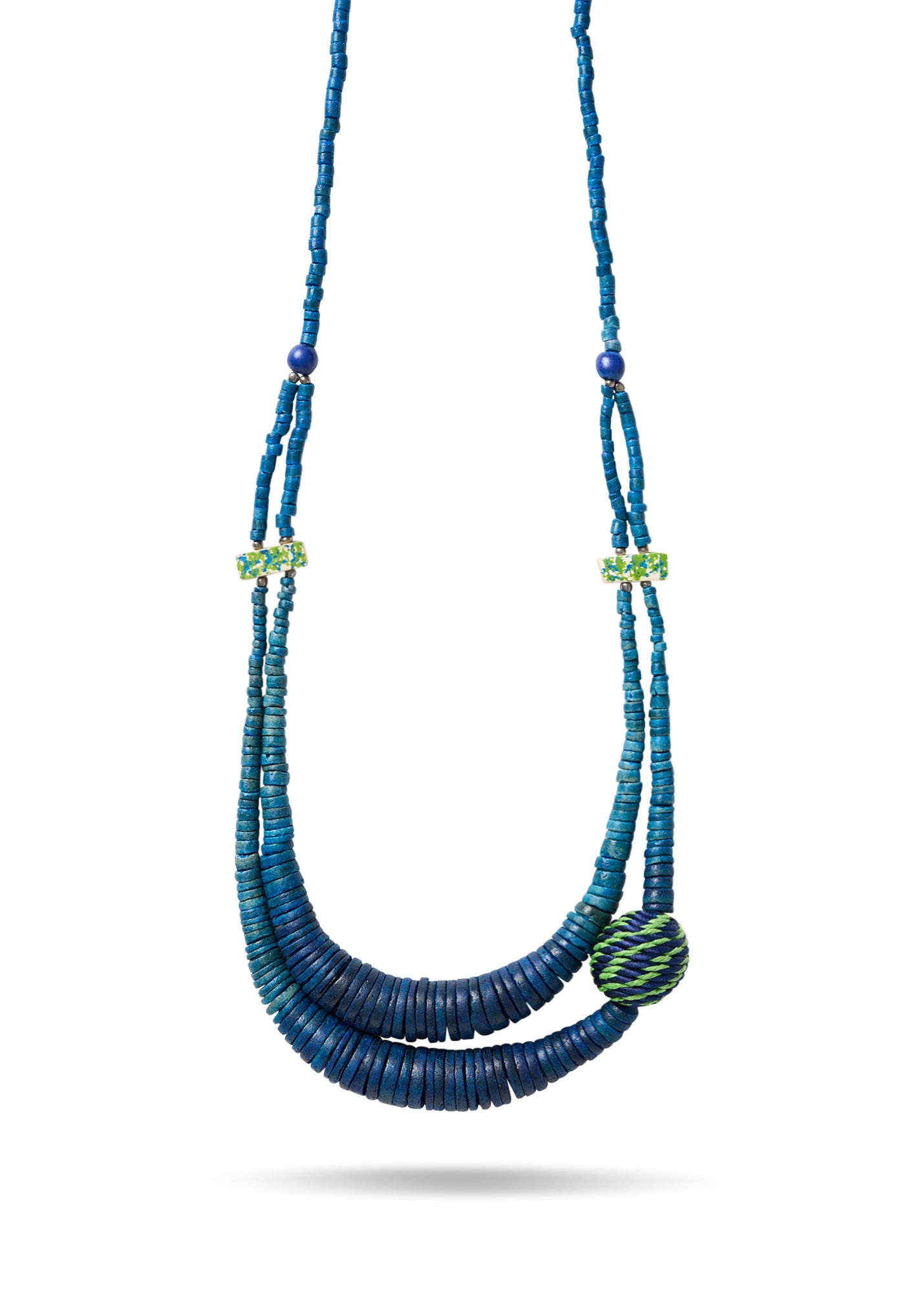 A necklace of coconut discs and a blue coiled bead