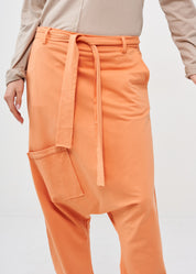 Pants with pockets and an orange belt