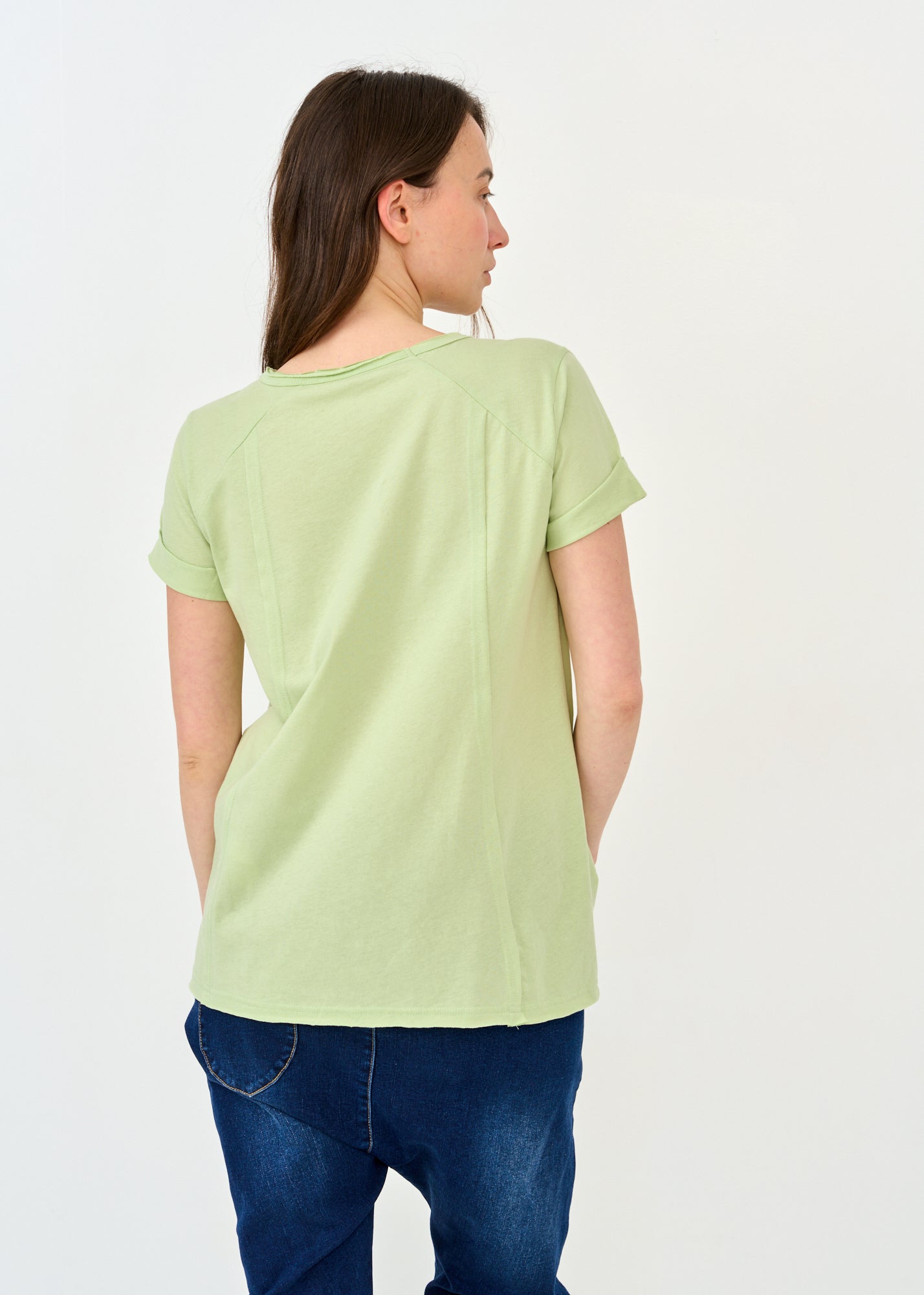 Rounded front short sleeve shirt with green cutouts