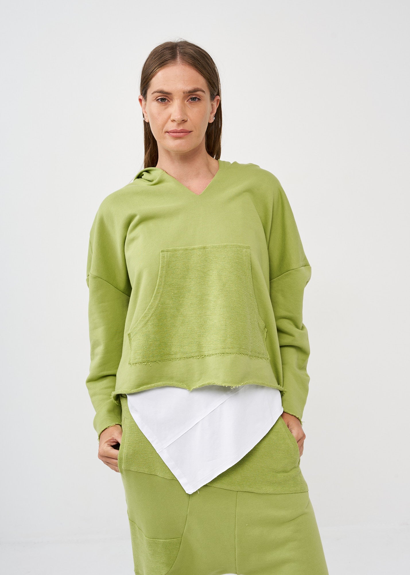 Oversized sweatshirt with a hood and a large green pocket