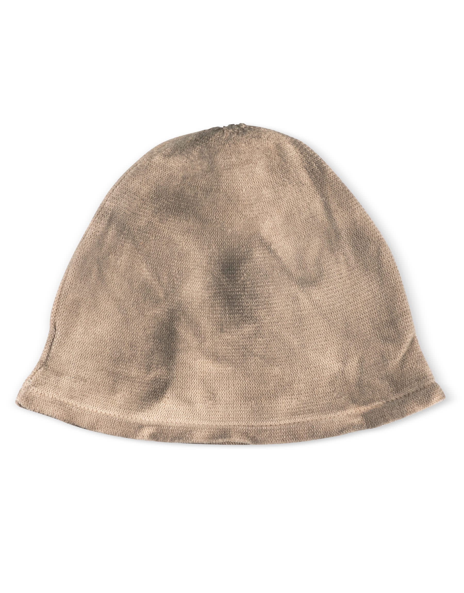 A sock hat rolls around in a beige wash