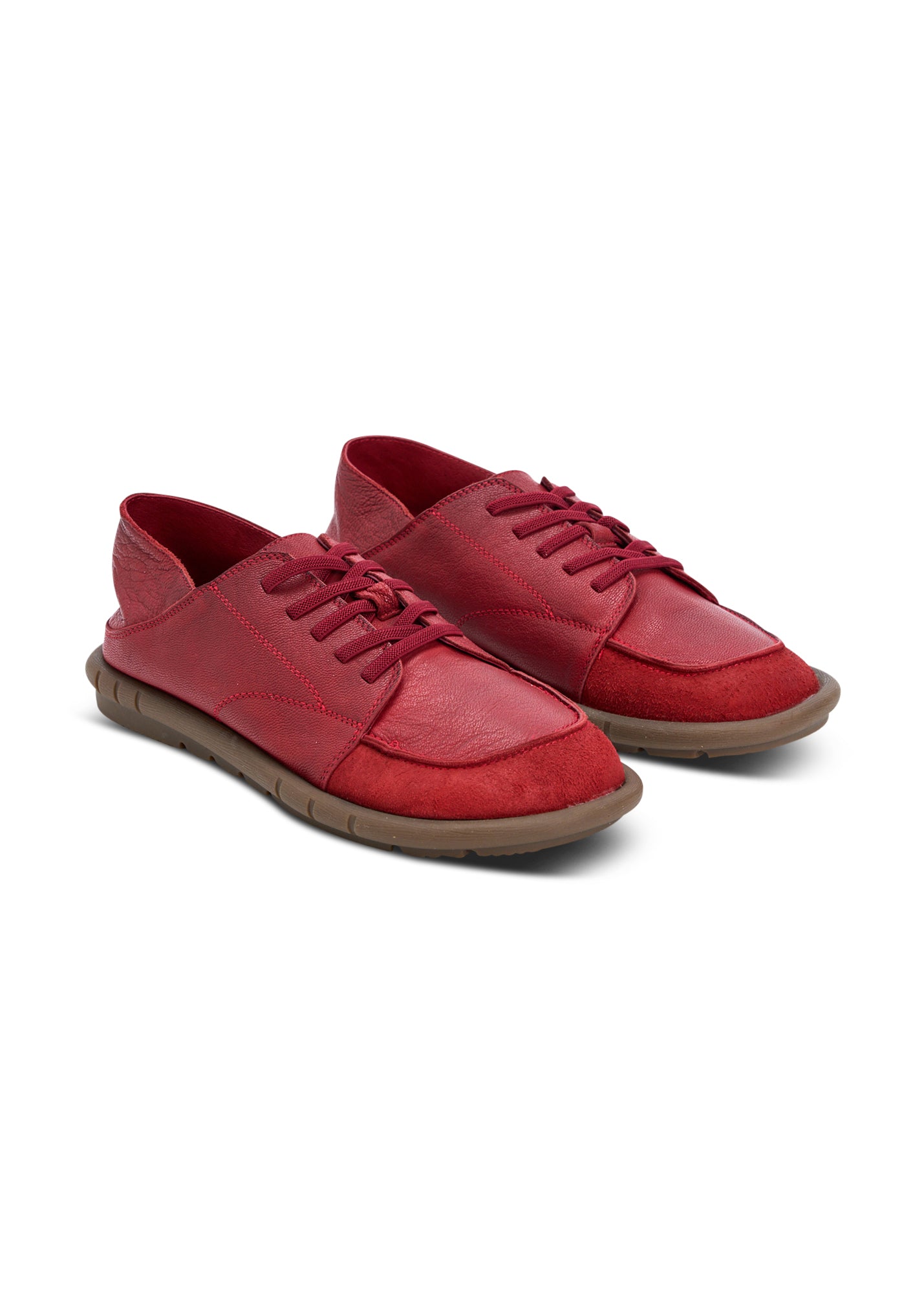 Soft leather shoes with a folding heel and red rubber laces