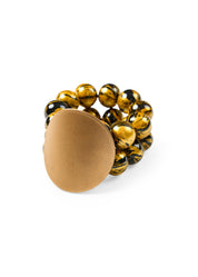 A bracelet with wooden beads and a gold disk