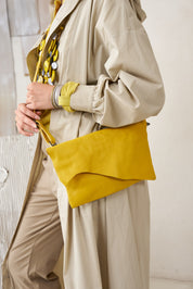 Rectangular leather evening bag with yellow asymmetric flap