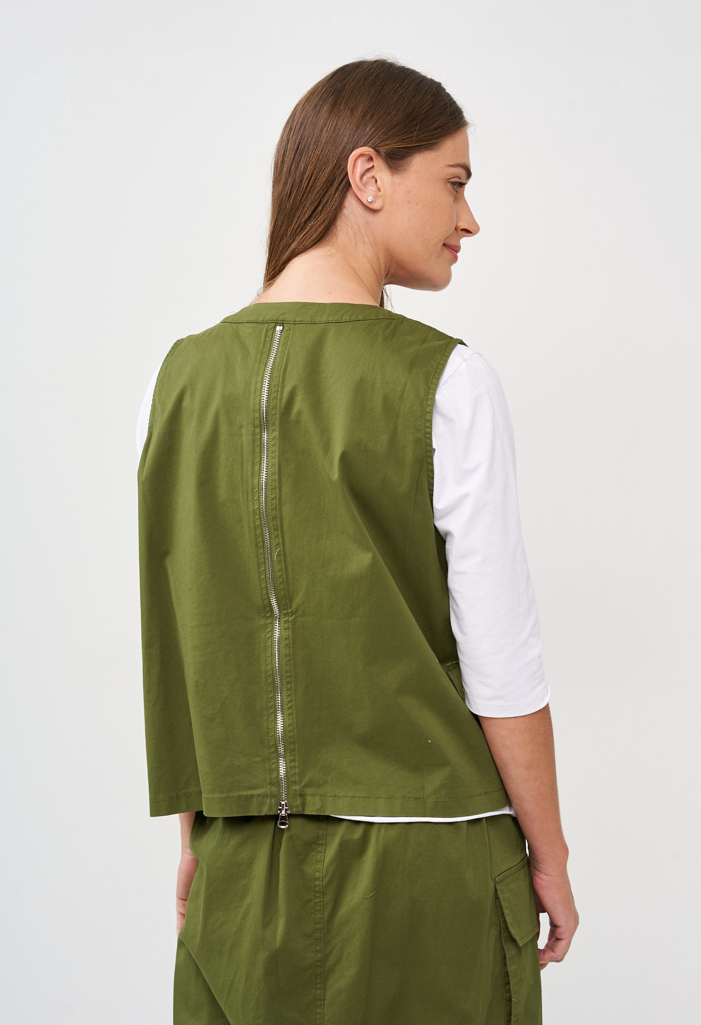 A green two-zip vest