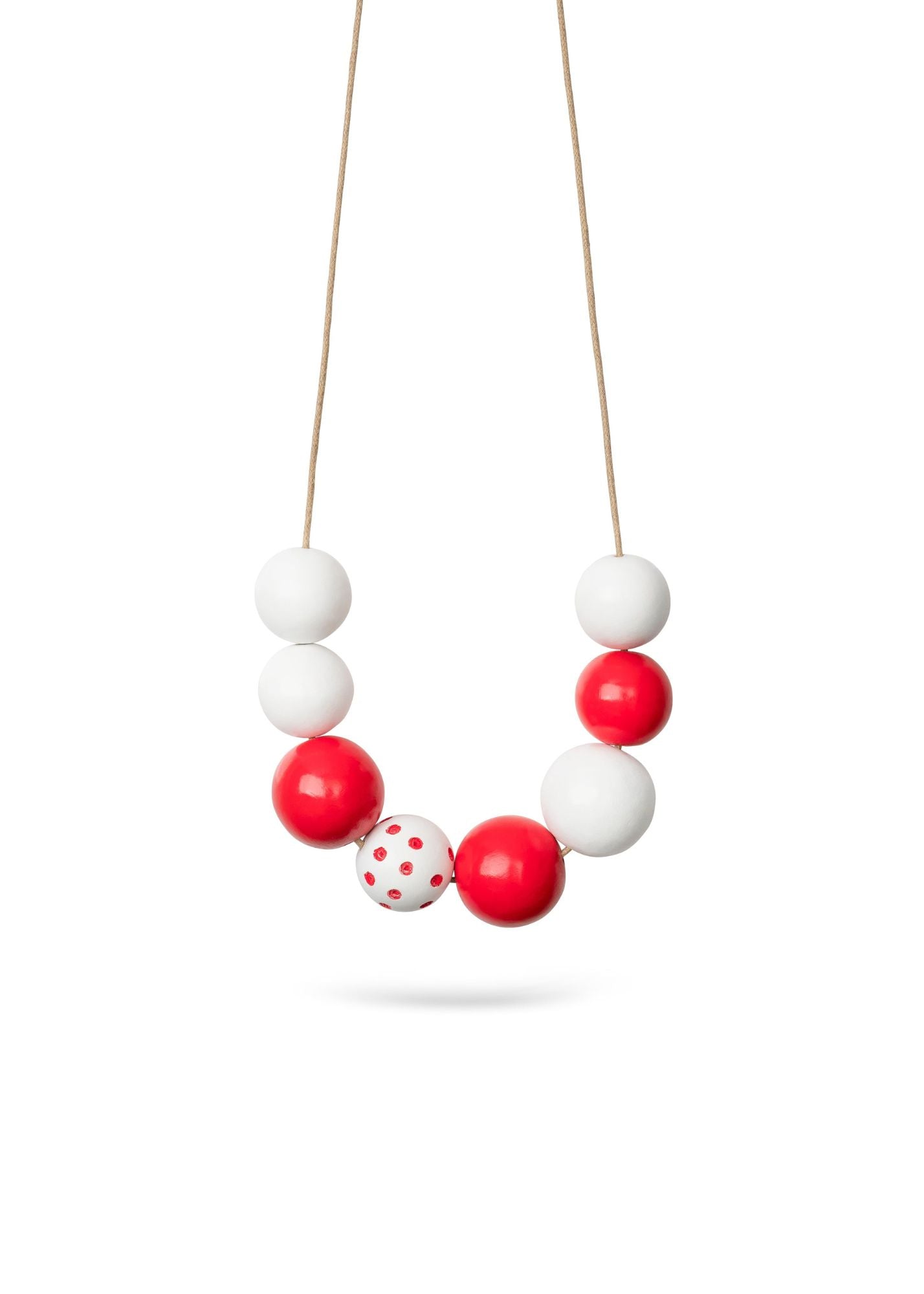 A necklace of large red dotted beads