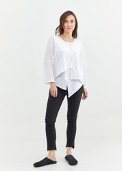 Asymmetric top with a white button