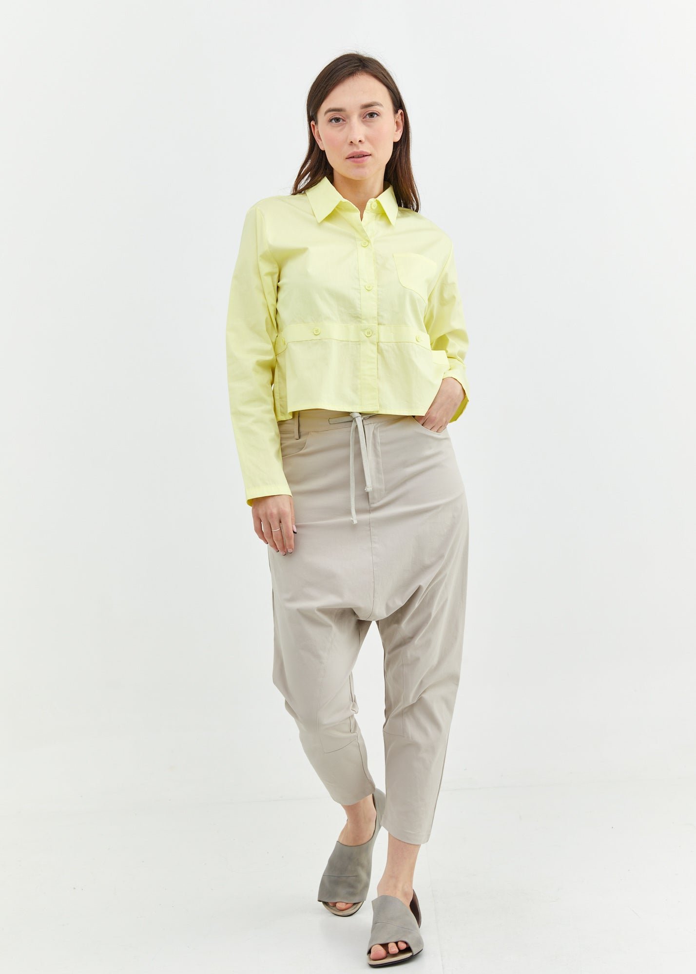 A button-down shirt is getting ready for a yellow short