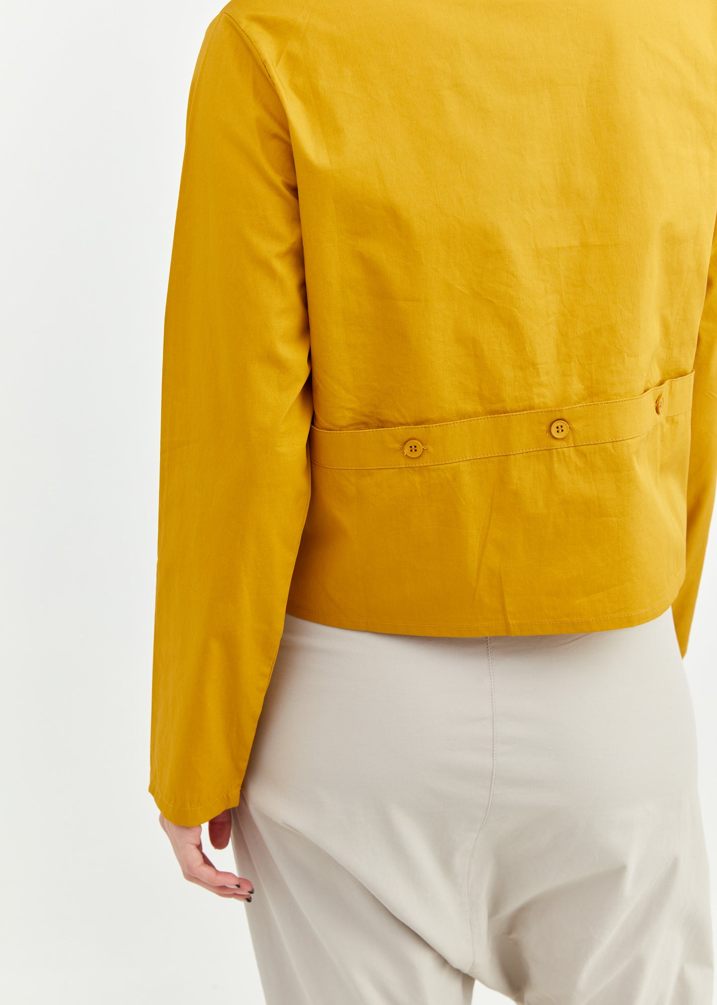 A button-up shirt is getting ready for mustard