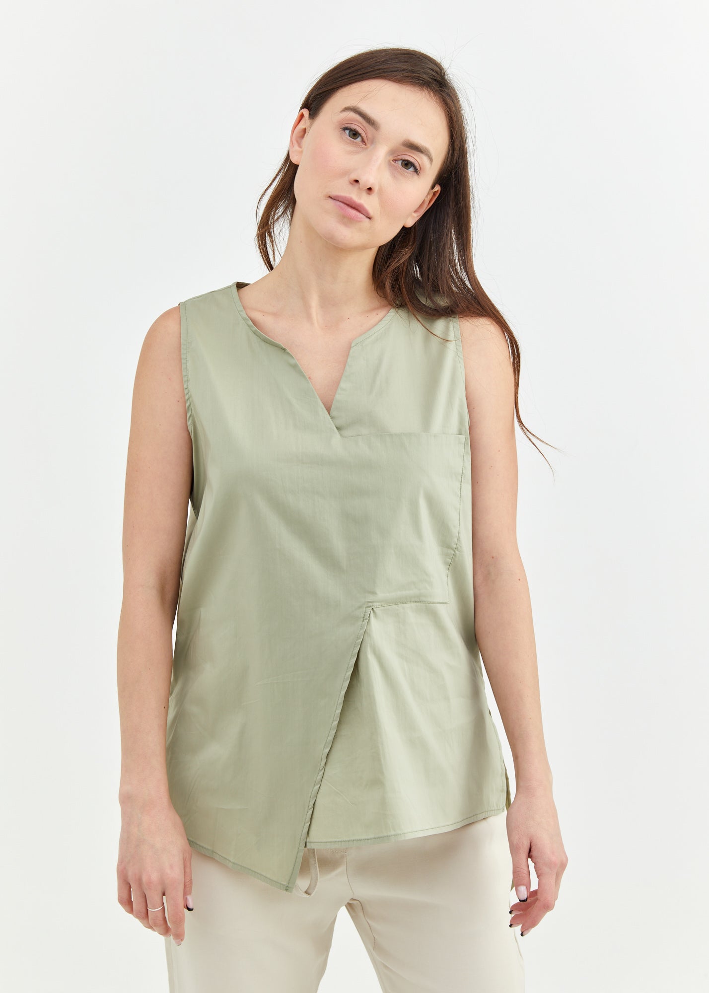 Asymmetric tank top and green fabric pocket