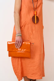 Leather evening bag with pocket and orange flap