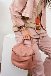 Small leather bag handle with pink shrinks