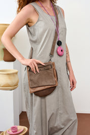 Gray three-pocket leather evening bag