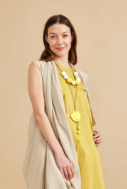 A necklace of large yellow dotted beads