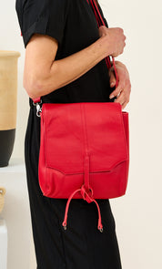 Red two-compartment front tie leather bag