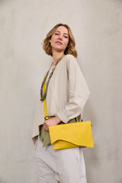 Rectangular leather evening bag with yellow asymmetric flap