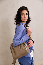 Small leather backpack with beige side compartments