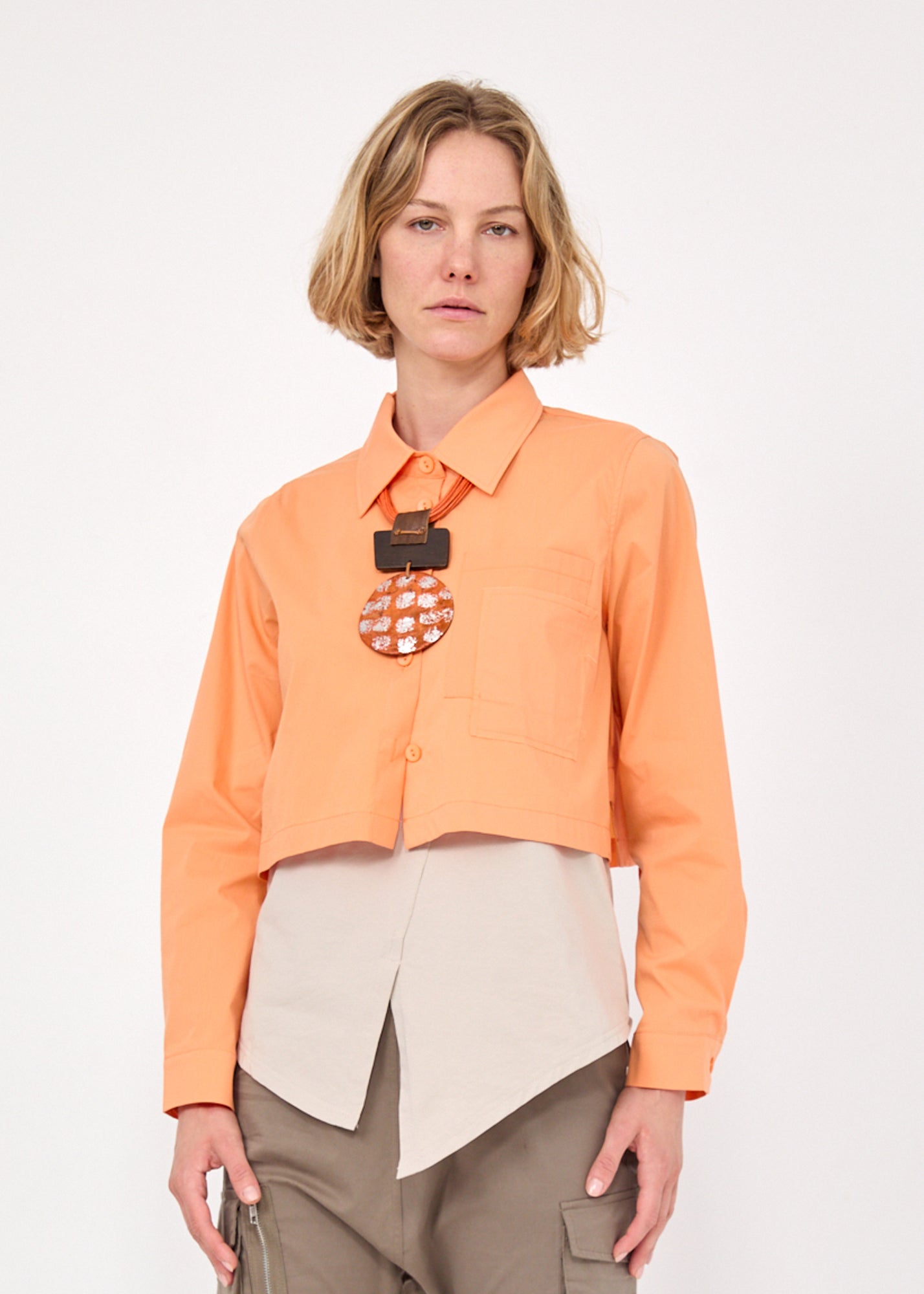 Short button-up with orange rounded openings