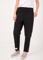 Pants with a seam in the middle and a classic black patch