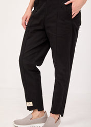 Pants with a seam in the middle and a classic black patch