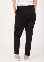 Pants with a seam in the middle and a classic black patch