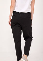 Pants with a seam in the middle and a classic black patch