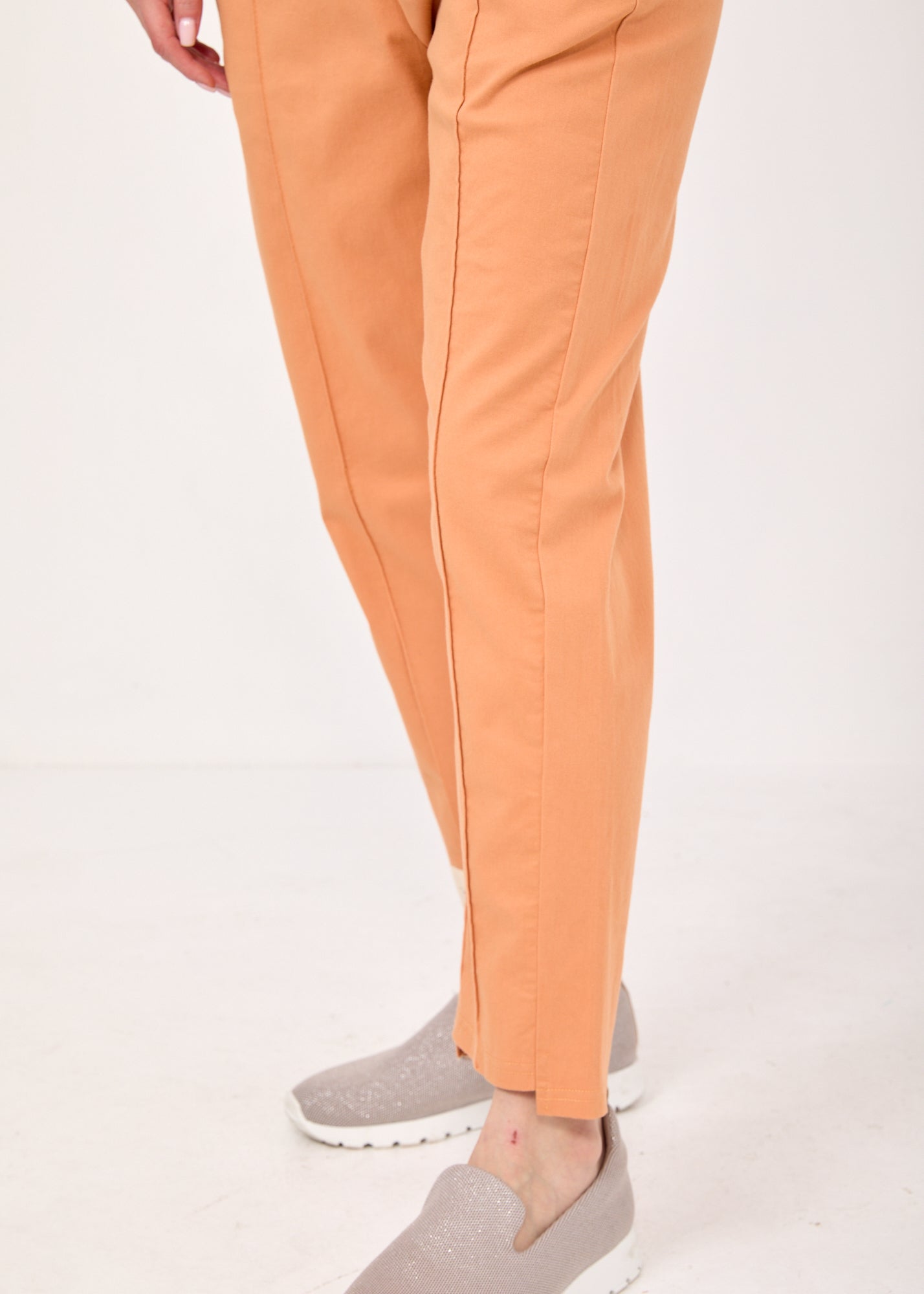 Pants with a seam in the middle and a classic orange patch