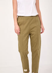 Pants with a seam in the middle and a green classic patch