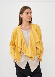 A thin top with a mustard wrapped scarf