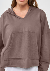 Oversized sweatshirt with hood and large brown pocket