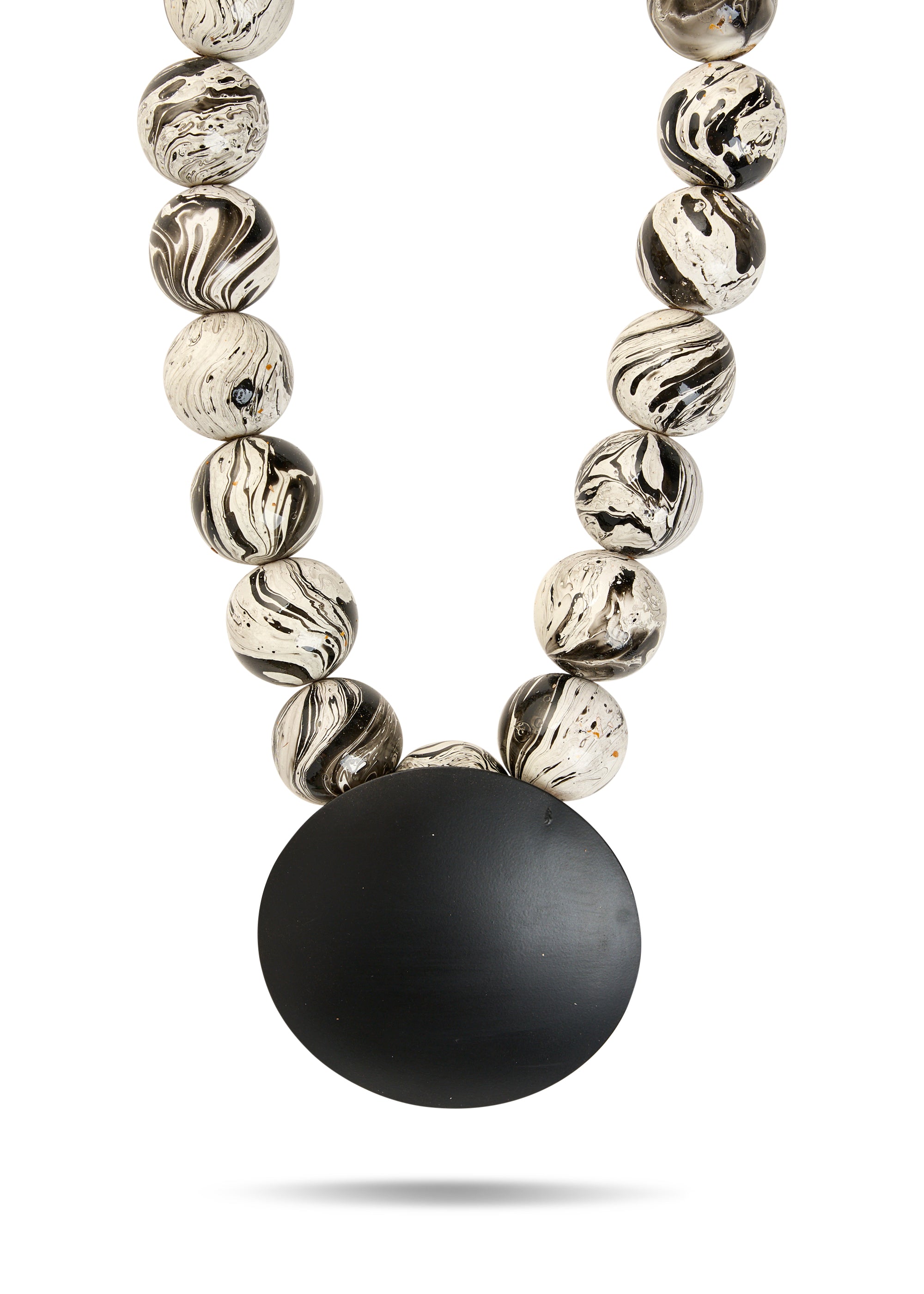 A necklace of wooden beads and a large black disk