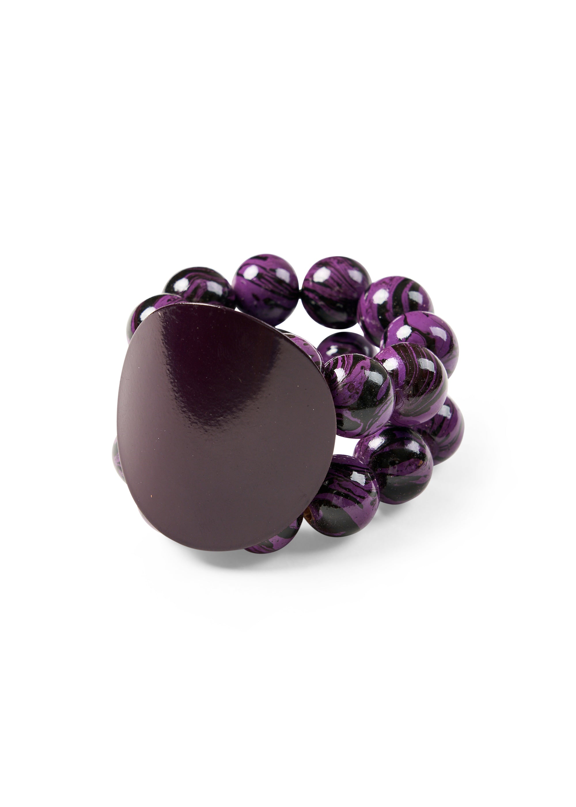 A bracelet with wooden beads and a purple disk