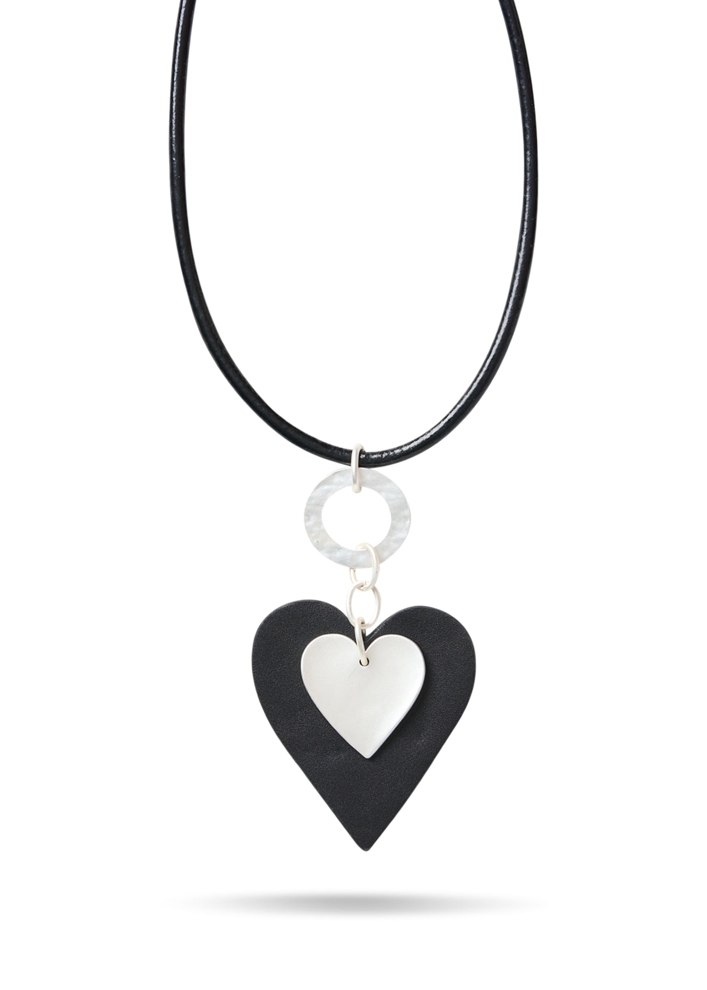 Leather heart necklace on a black leather heart