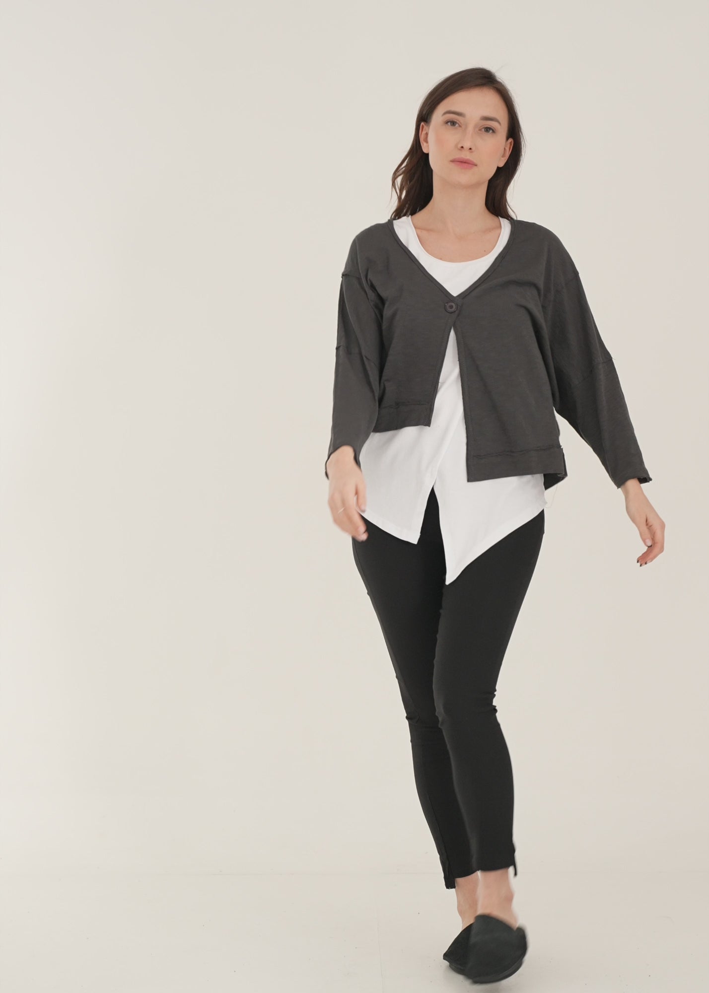 Asymmetric top with a white button