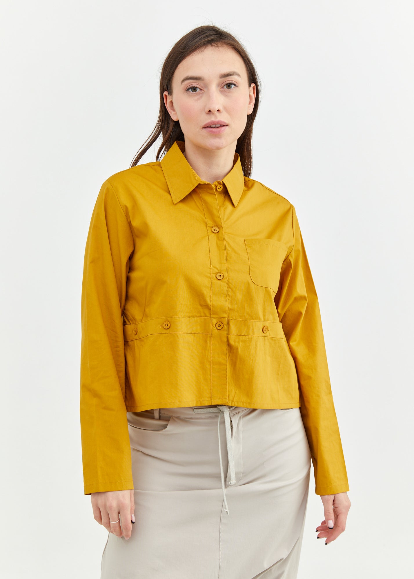 A button-up shirt is getting ready for mustard