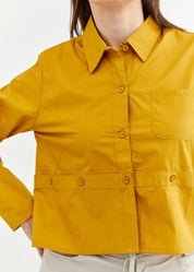 A button-up shirt is getting ready for mustard